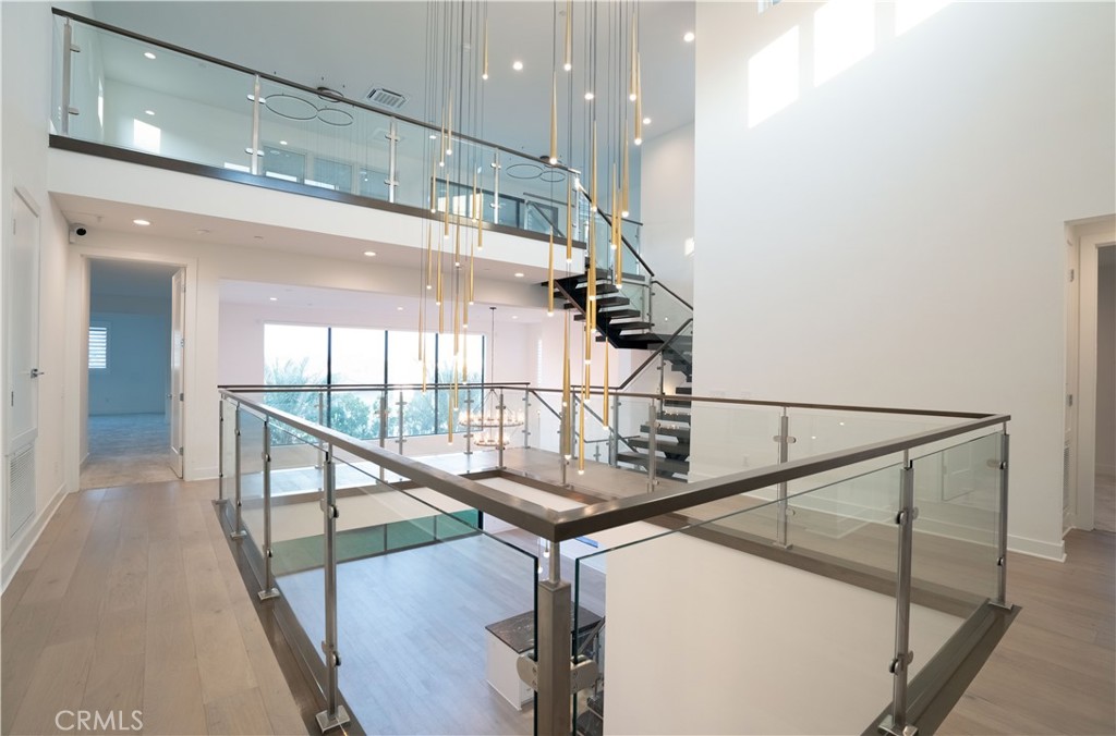 20043 Mersey Lane Porter Ranch, CA 91326 - Photo 47 of 68 a view of entryway and hall with wooden floor
