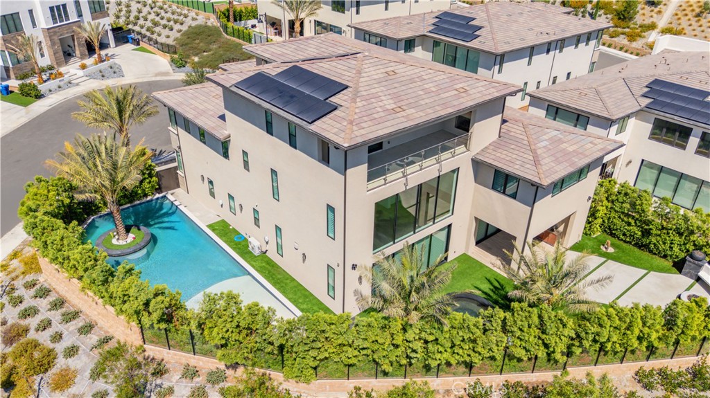 20043 Mersey Lane Porter Ranch, CA 91326 - Photo 5 of 68 a aerial view of a house with swimming pool lawn chairs and flower plants