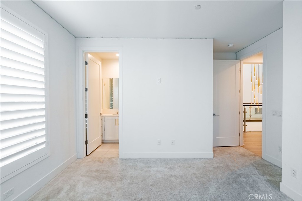 20043 Mersey Lane Porter Ranch, CA 91326 - Photo 51 of 68 an empty room with windows and closet