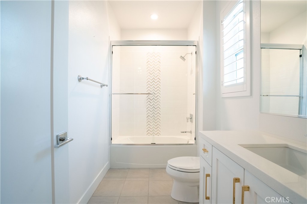 20043 Mersey Lane Porter Ranch, CA 91326 - Photo 55 of 68 a bathroom with a granite countertop sink toilet and shower