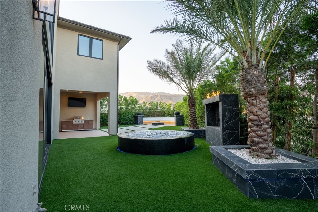 20043 Mersey Lane Porter Ranch, CA 91326 - Photo 66 of 68 a view of a house with backyard and sitting area