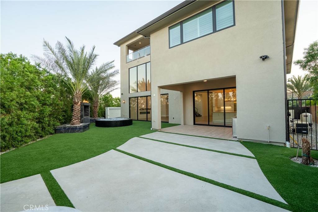 20043 Mersey Lane Porter Ranch, CA 91326 - Photo 68 of 68 a front view of a house with a garden and yard