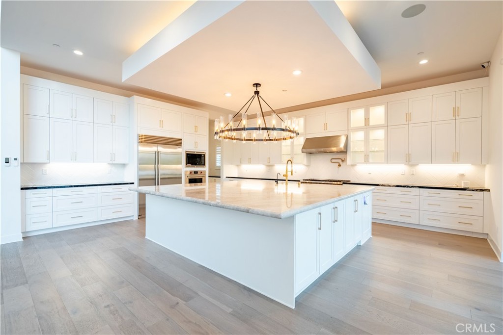 20043 Mersey Lane Porter Ranch, CA 91326 - Photo 10 of 68 a kitchen with stainless steel appliances granite countertop a sink and cabinets