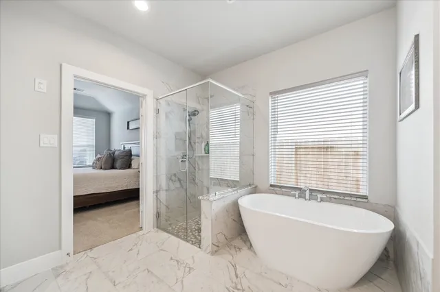 a bathroom with a bathtub and a sink