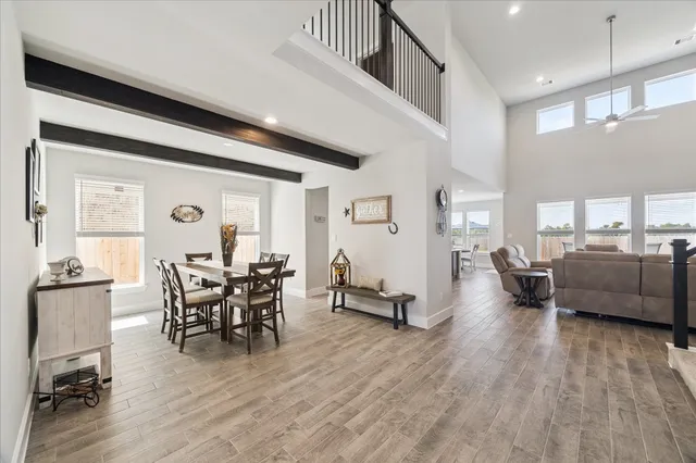 a view of a livingroom with furniture and a wooden floor