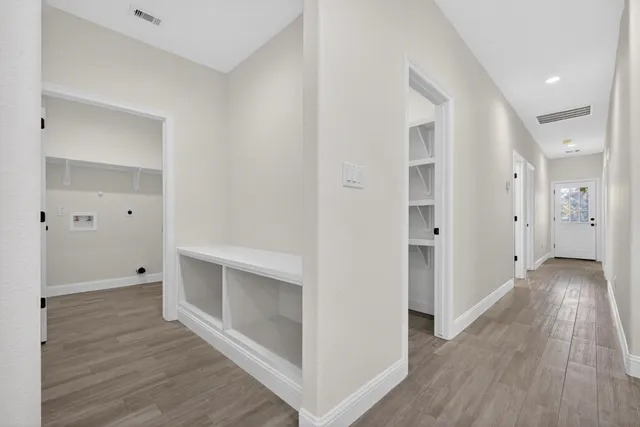 a view of room and stairs and a ceiling fan