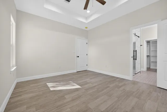 a bathroom with a shower and a sink