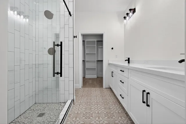 a bathroom with a toilet and shower