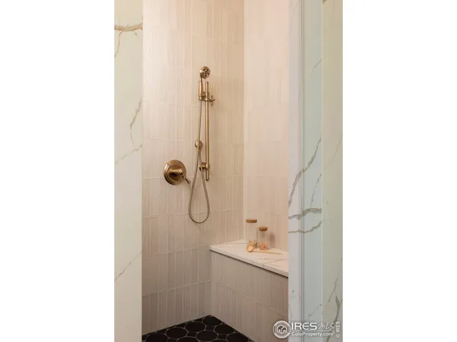 a view of walk in closet with cabinet