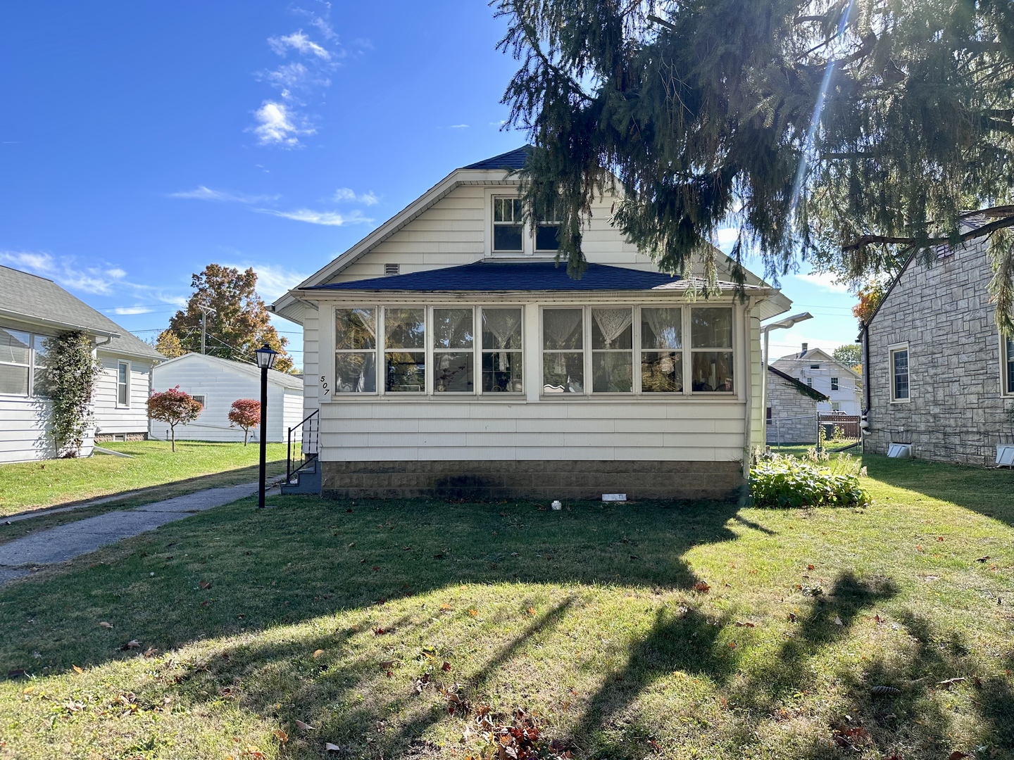 507 West 12th Street Sterling, IL 61081 - Photo 2 of 14 a front view of a house with garden