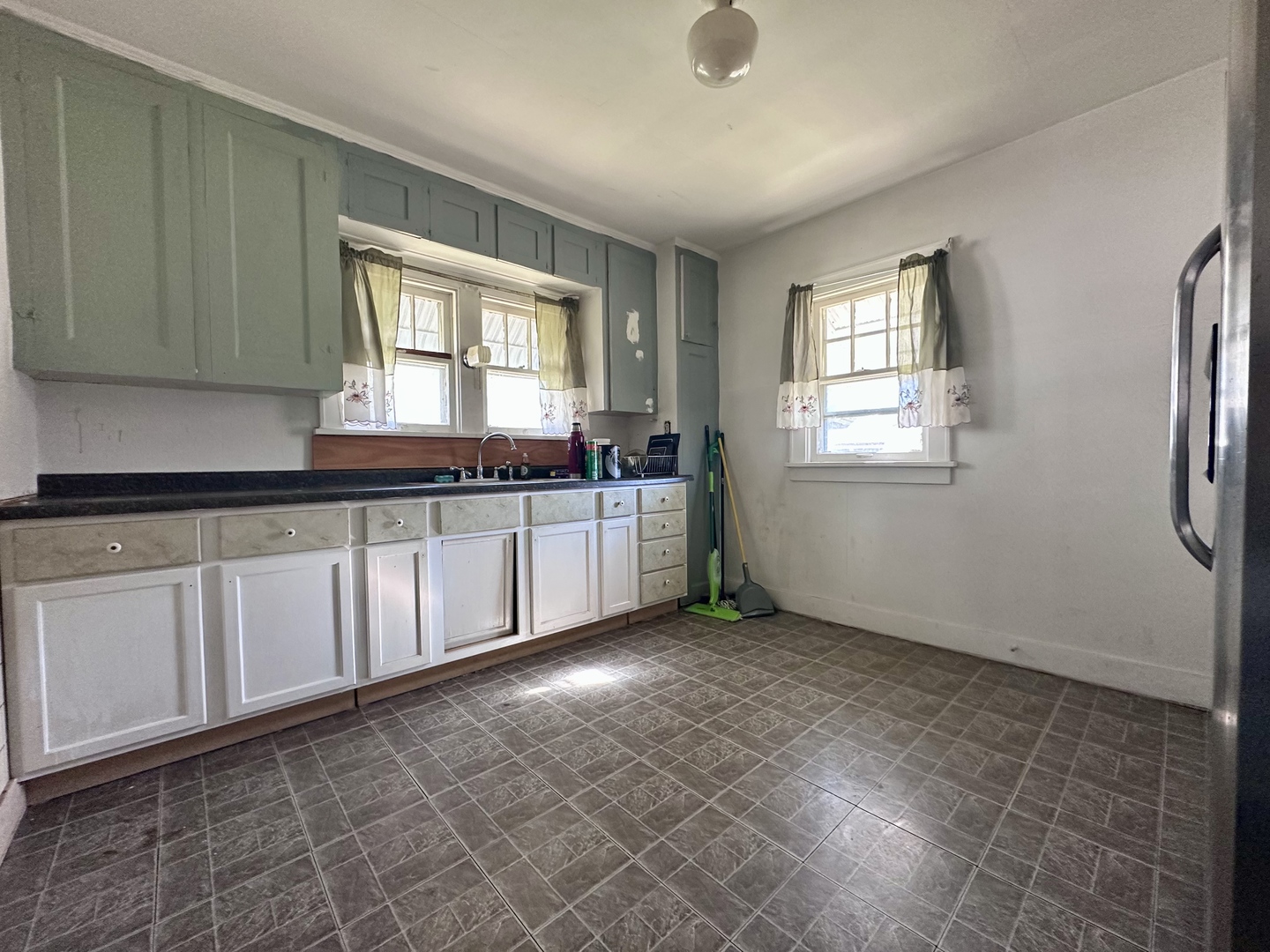 507 West 12th Street Sterling, IL 61081 - Photo 8 of 14 a kitchen with a sink and cabinets