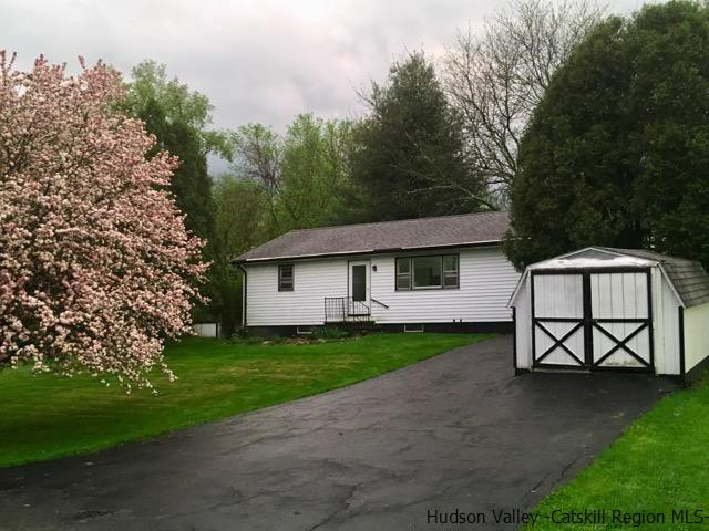 79 White Lands Road Stone Ridge, NY 12484 - Photo 1 of 10 a front view of a house with garden