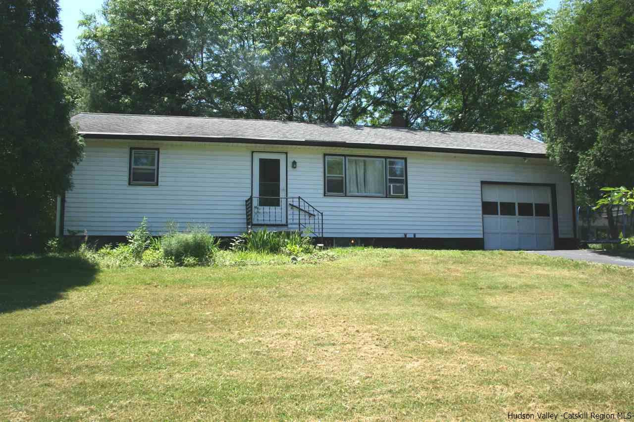 79 White Lands Road Stone Ridge, NY 12484 - Photo 3 of 10 a front view of a house with a garden