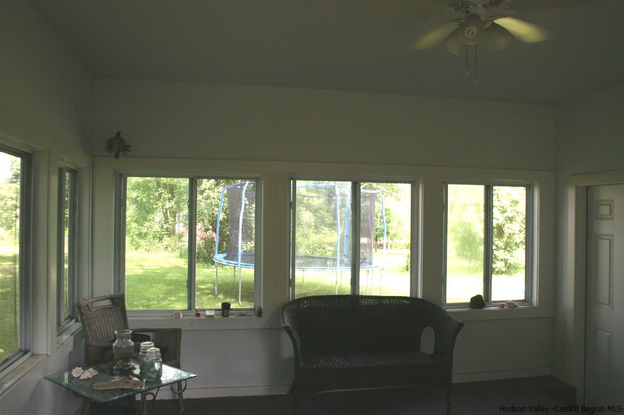 79 White Lands Road Stone Ridge, NY 12484 - Photo 8 of 10 a living room with furniture and a large window