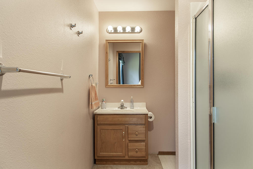 1735 Robertson Bridge Road Grants Pass, OR 97526 - Photo 17 of 47 a bathroom with a sink and a mirror