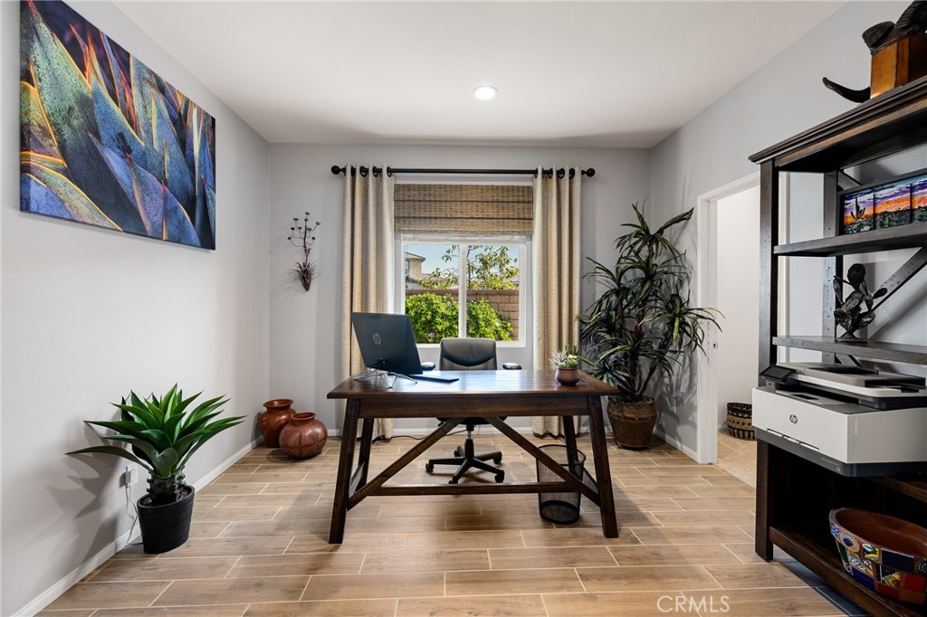 29981 Western Front Drive Menifee, CA 92584 - Photo 11 of 74 a workspace with furniture window and book shelf