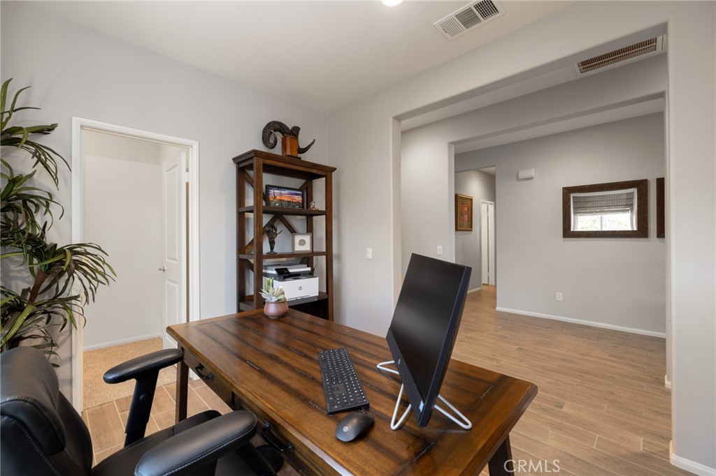 29981 Western Front Drive Menifee, CA 92584 - Photo 12 of 74 a view of a workspace with furniture and bedroom
