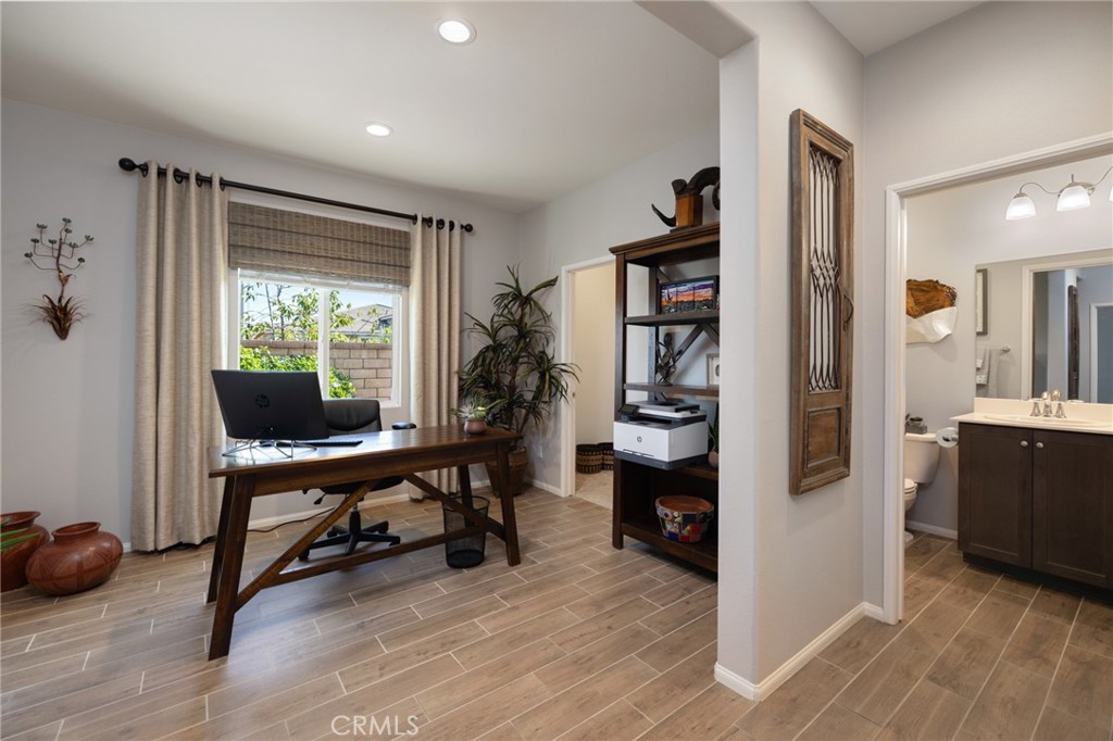 29981 Western Front Drive Menifee, CA 92584 - Photo 13 of 74 a view of a livingroom with workspace and a window