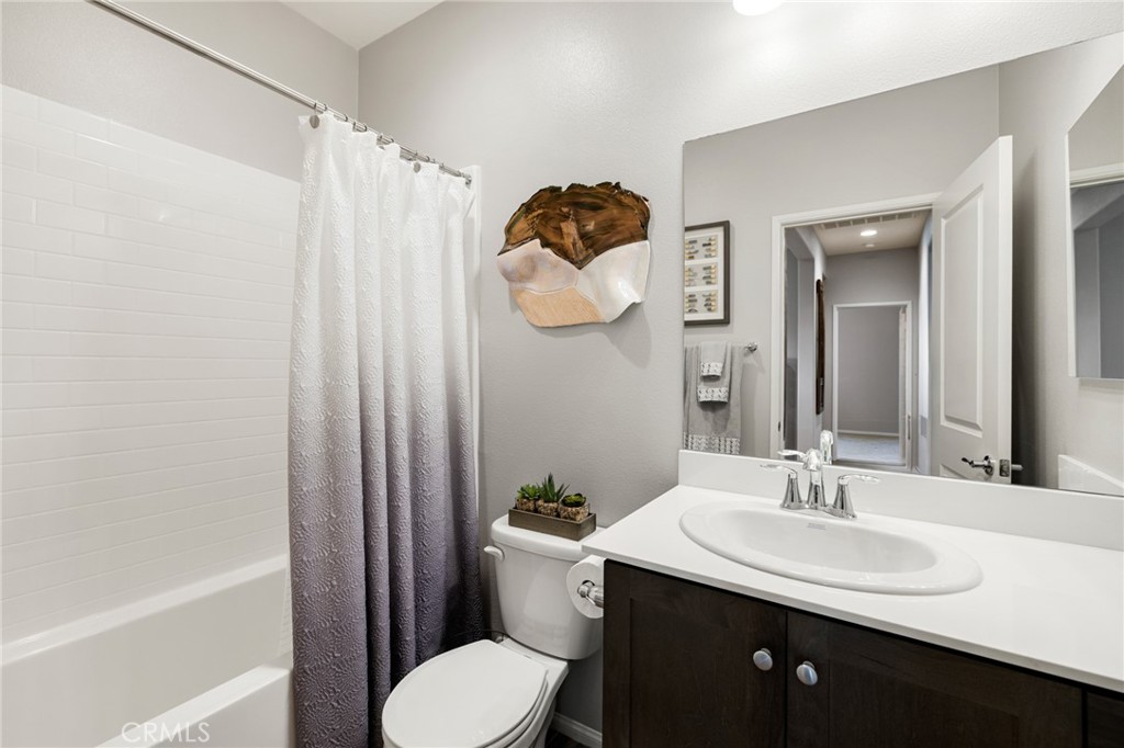 29981 Western Front Drive Menifee, CA 92584 - Photo 14 of 74 a bathroom with a sink toilet and shower