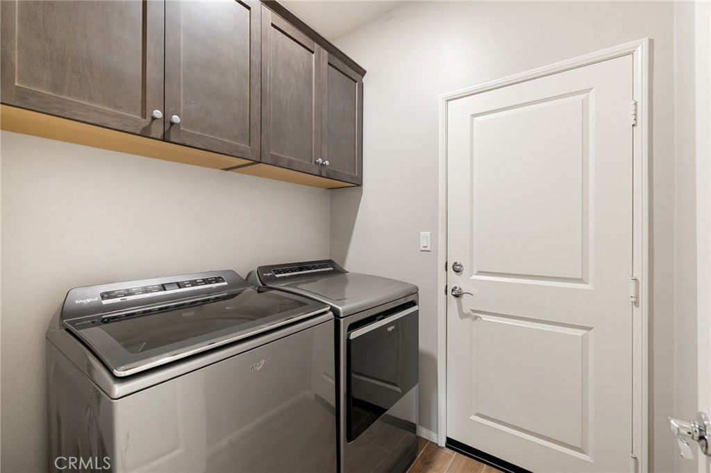 29981 Western Front Drive Menifee, CA 92584 - Photo 18 of 74 a utility room with dryer and washer