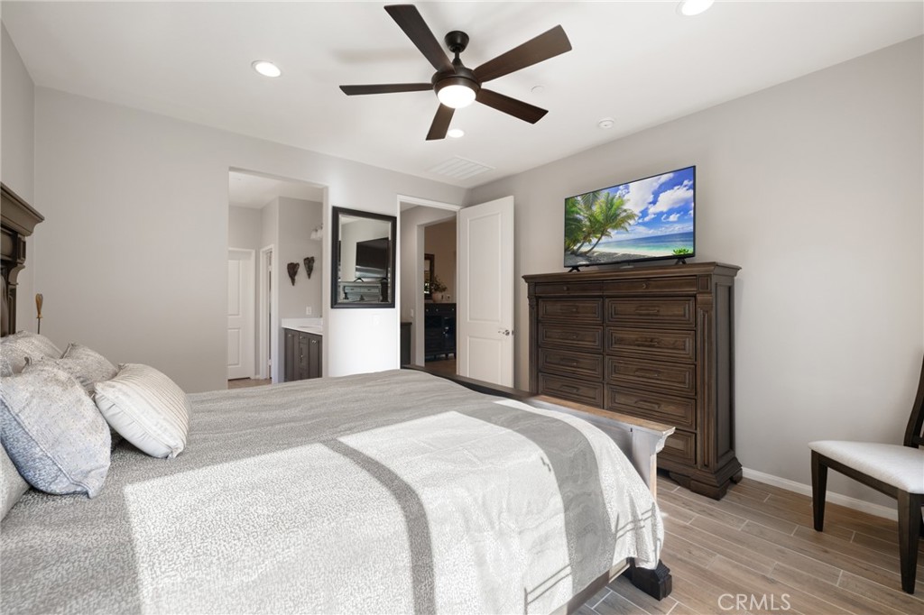 29981 Western Front Drive Menifee, CA 92584 - Photo 38 of 74 a bedroom with a bed and a flat screen tv