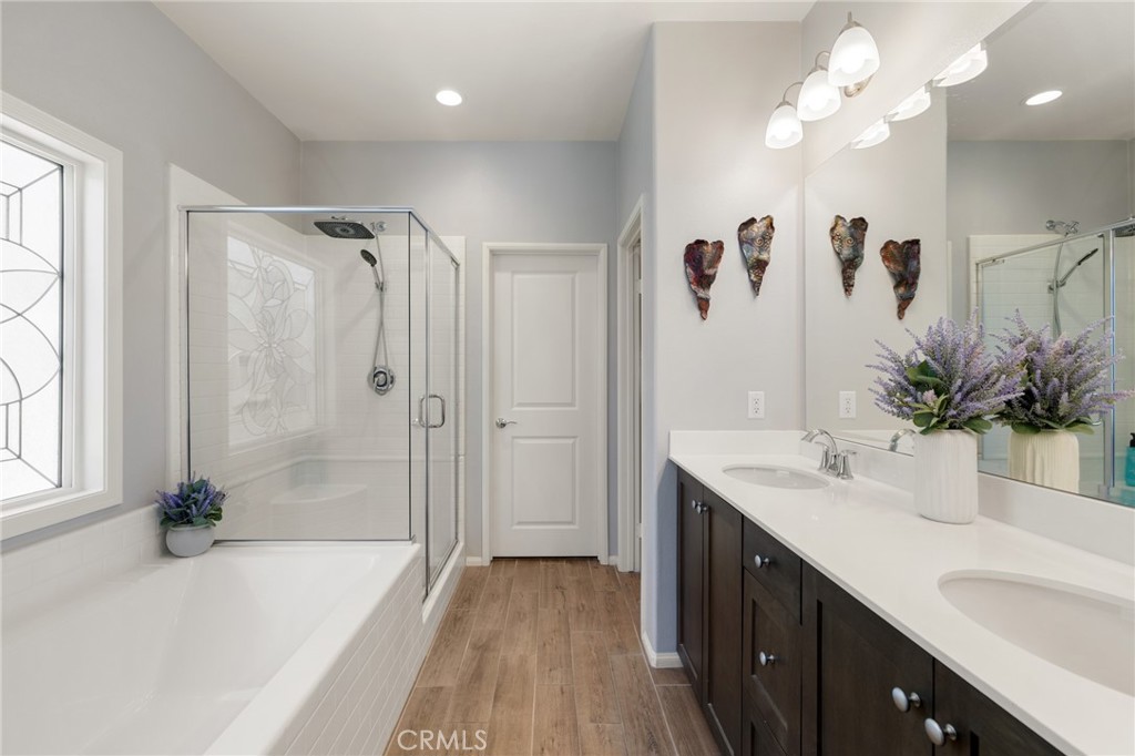 29981 Western Front Drive Menifee, CA 92584 - Photo 39 of 74 a bathroom with a tub sink and mirror