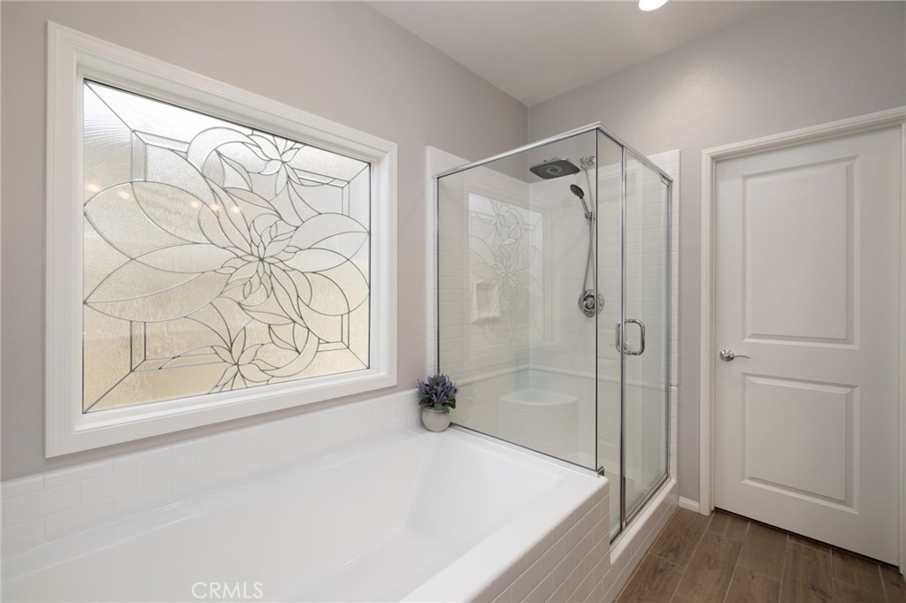 29981 Western Front Drive Menifee, CA 92584 - Photo 40 of 74 a bathroom with a bathtub and a shower