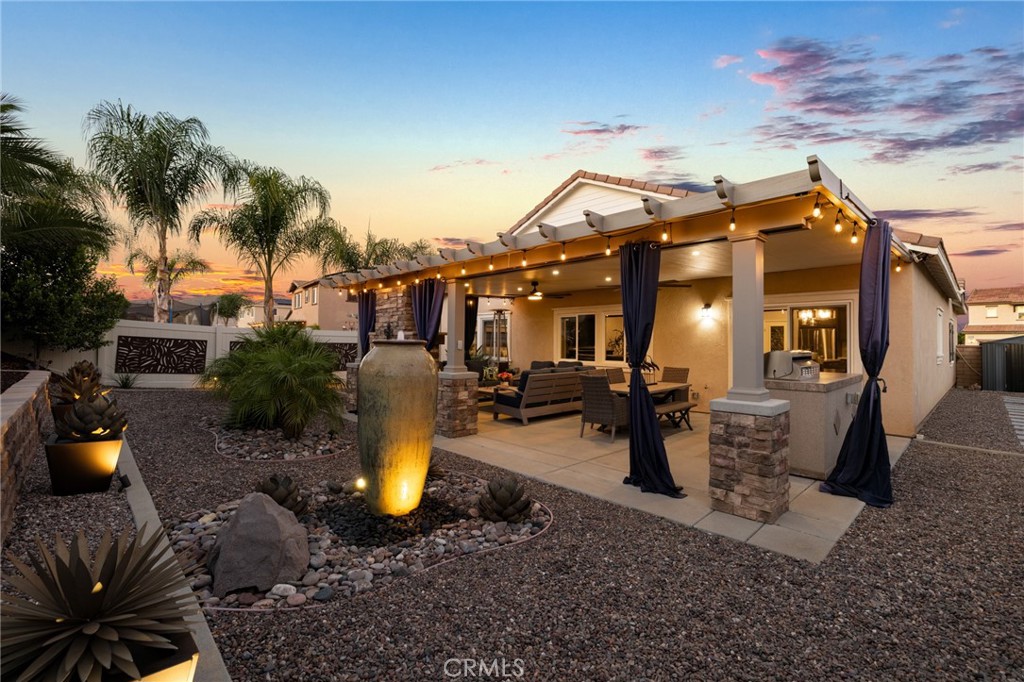 29981 Western Front Drive Menifee, CA 92584 - Photo 50 of 74 a view of a backyard with plants and a patio