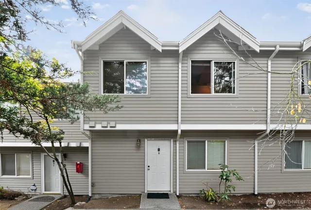 a front view of a house with garage