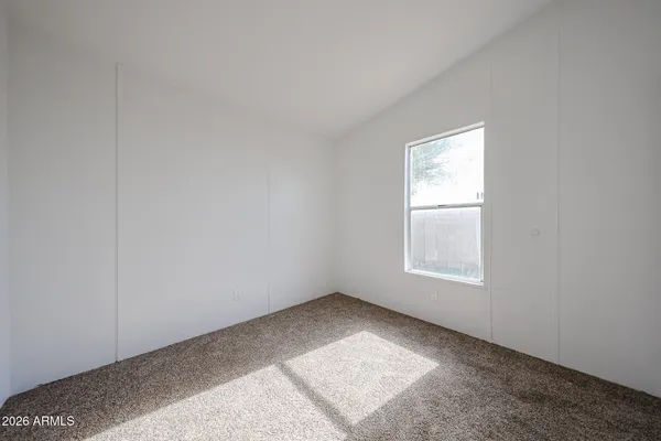 a view of a room with table and a table