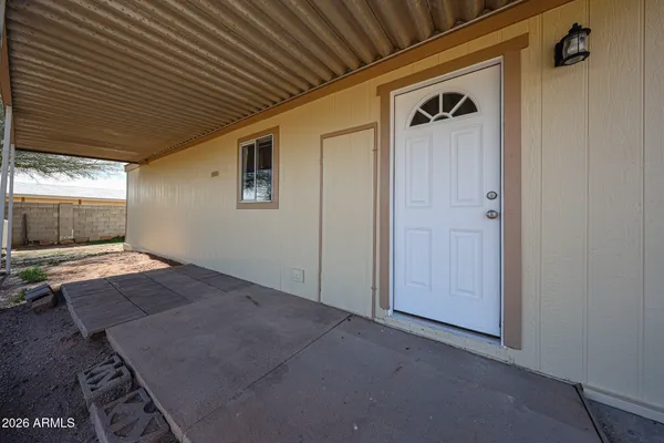 a view of a backyard of the house