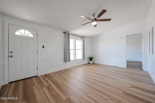 a kitchen with stainless steel appliances granite countertop a refrigerator a stove a sink and a microwave