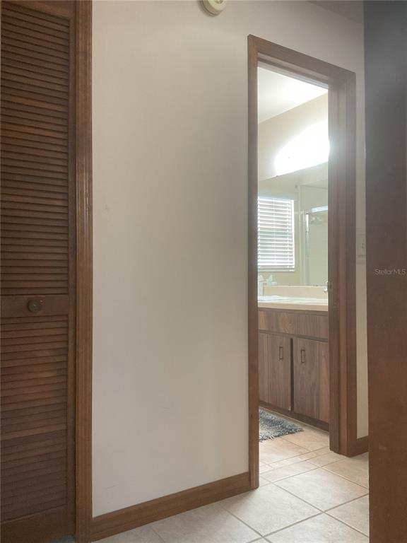17005 Arrowhead Boulevard Winter Garden, FL 34787 - Photo 14 of 53 a room that has a mirror in it