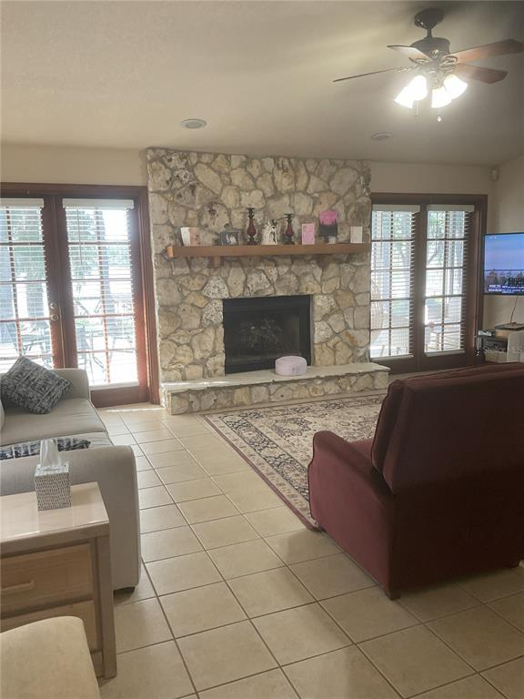 17005 Arrowhead Boulevard Winter Garden, FL 34787 - Photo 20 of 53 a living room with furniture and a fireplace