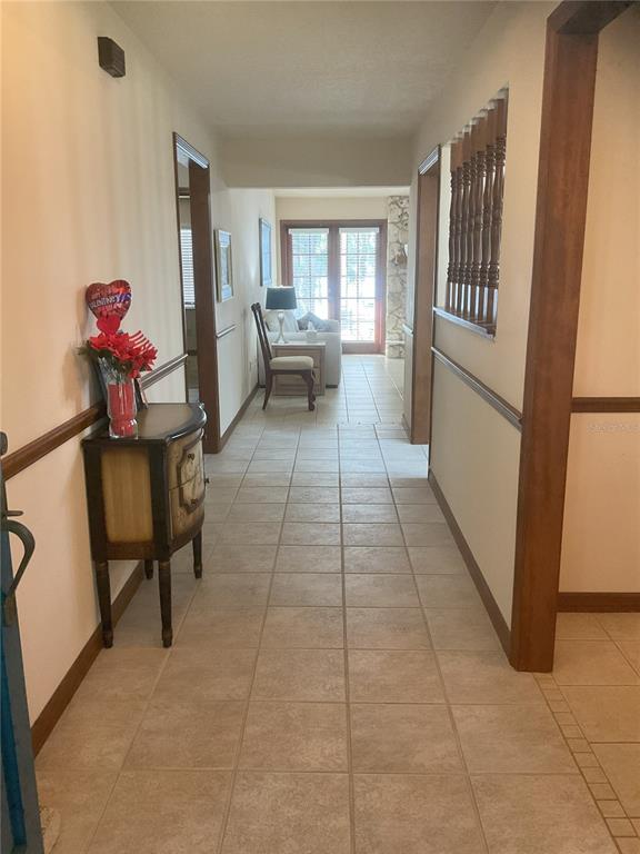 17005 Arrowhead Boulevard Winter Garden, FL 34787 - Photo 2 of 53 a view of a hallway with furniture and a window