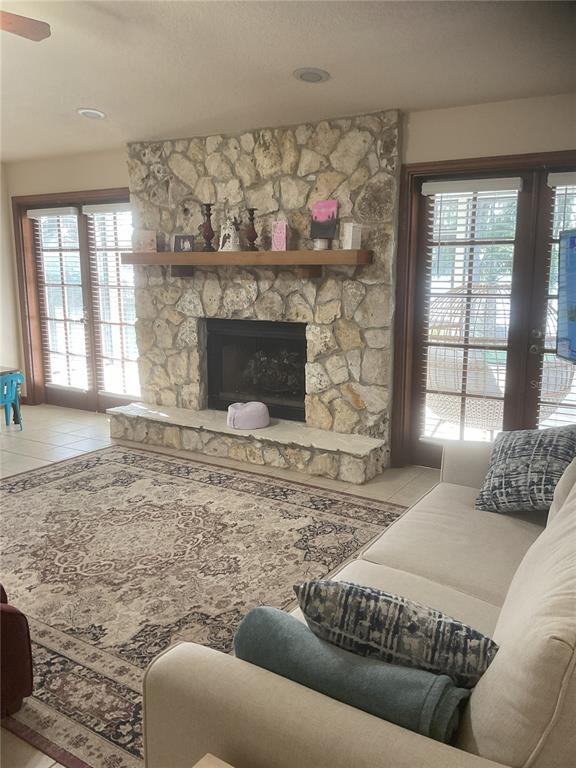 17005 Arrowhead Boulevard Winter Garden, FL 34787 - Photo 21 of 53 a living room with furniture and a fireplace