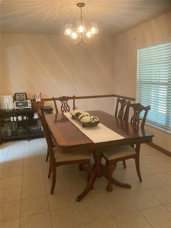 17005 Arrowhead Boulevard Winter Garden, FL 34787 - Photo 3 of 53 a view of a dining room with furniture