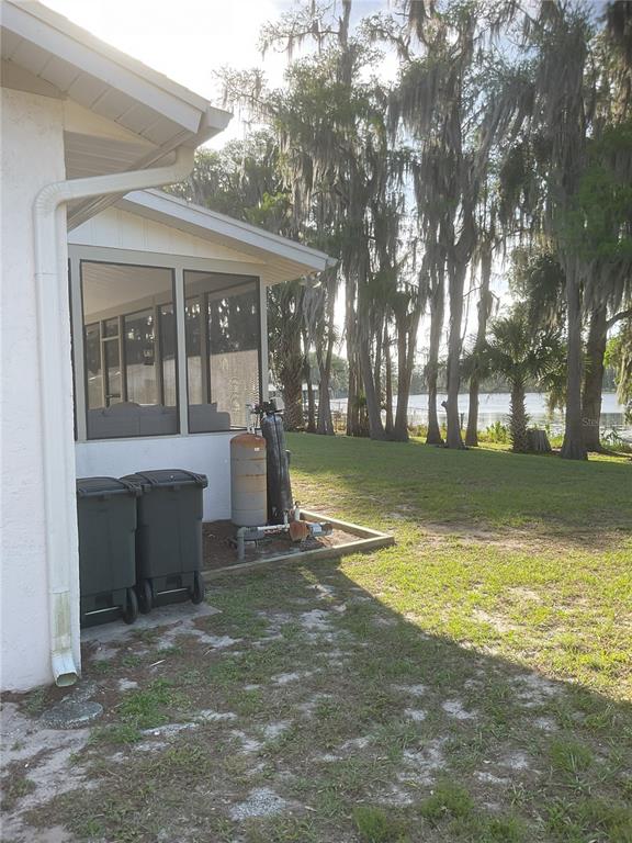 17005 Arrowhead Boulevard Winter Garden, FL 34787 - Photo 31 of 53 a view of a house with a yard and sitting area