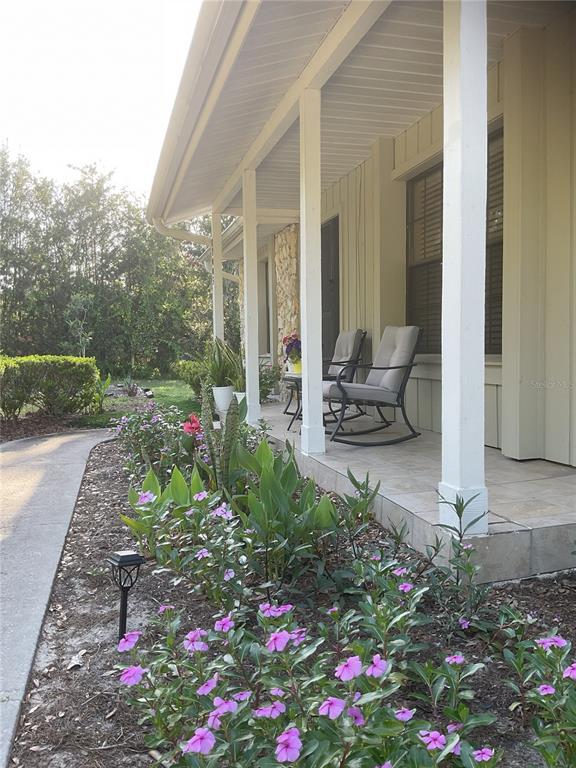17005 Arrowhead Boulevard Winter Garden, FL 34787 - Photo 37 of 53 a garden view with a seating space