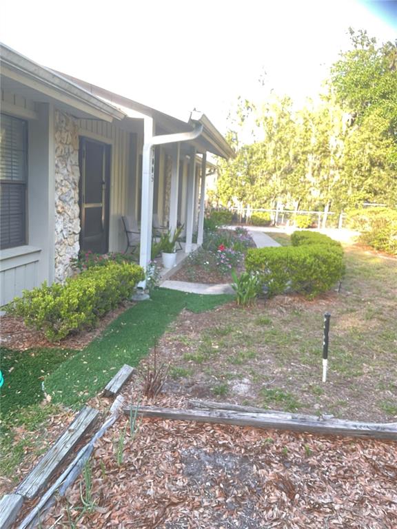 17005 Arrowhead Boulevard Winter Garden, FL 34787 - Photo 48 of 53 a front view of a house with garden