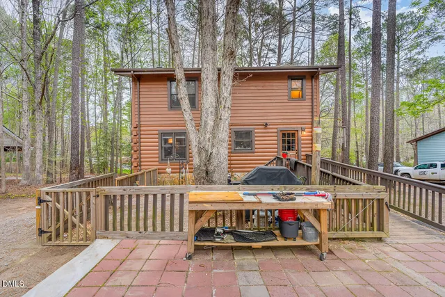 a view of a chairs and table on the deck