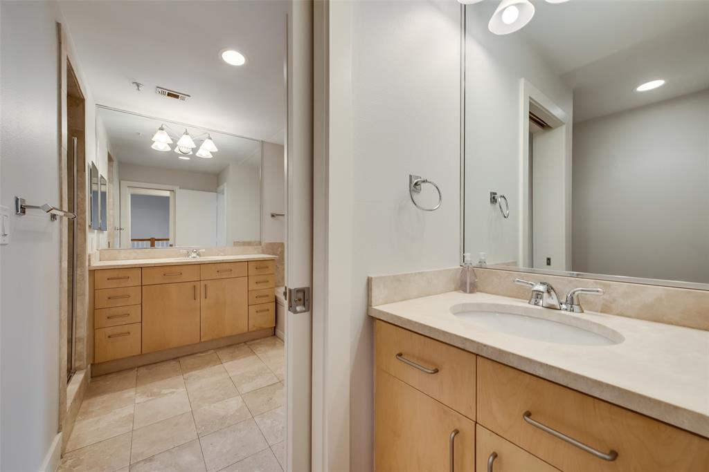 5055 Addison Circle, Unit 407 Addison, TX 75001 - Photo 22 of 22 Pocket Door separates one Vanity and the Toilet from Main Bath; this section can be accessed from hallway for guests.