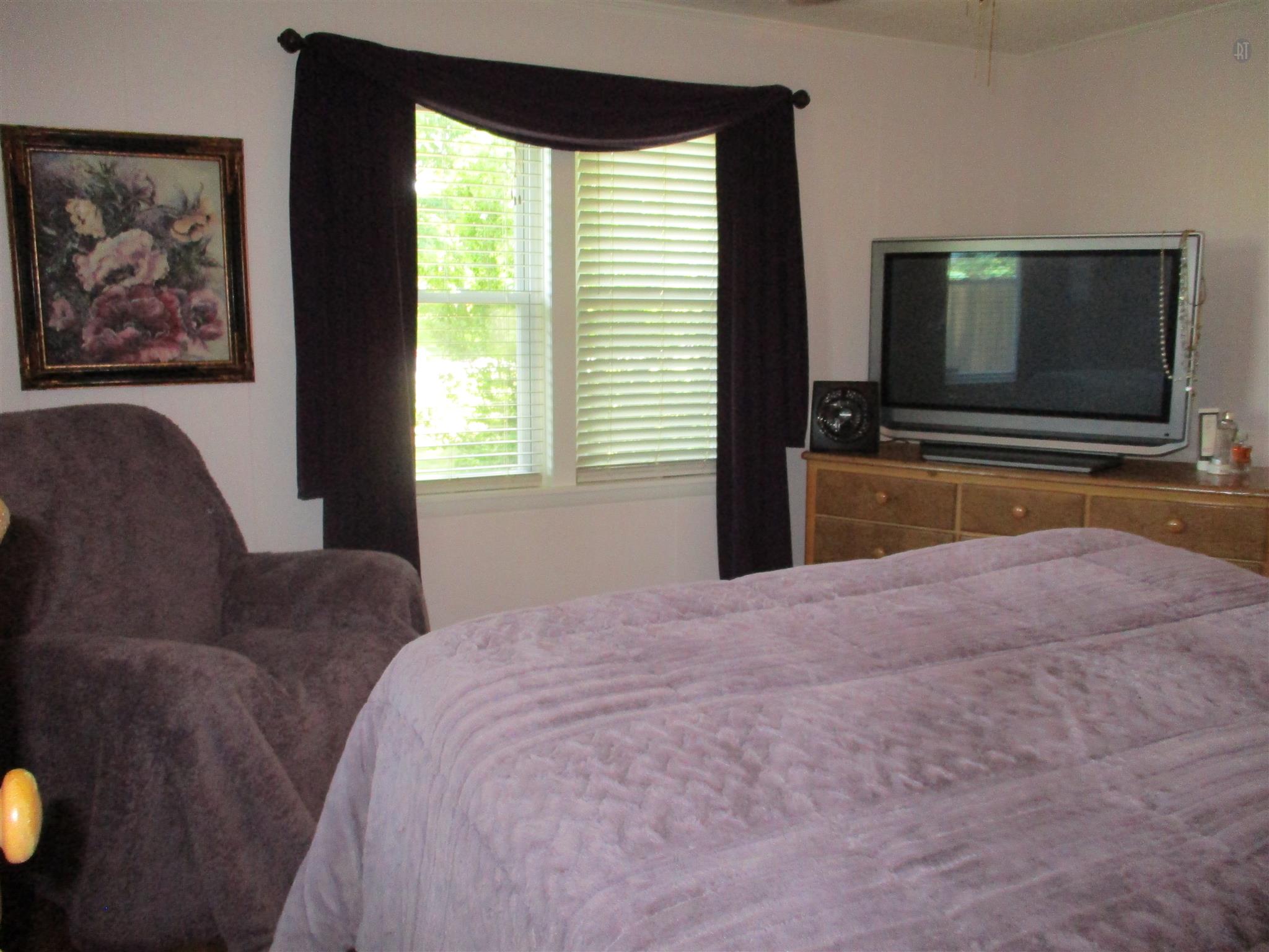 23 Ingram Road Leoma, TN 38468 - Photo 11 of 22 a bedroom with a bed and a flat screen tv