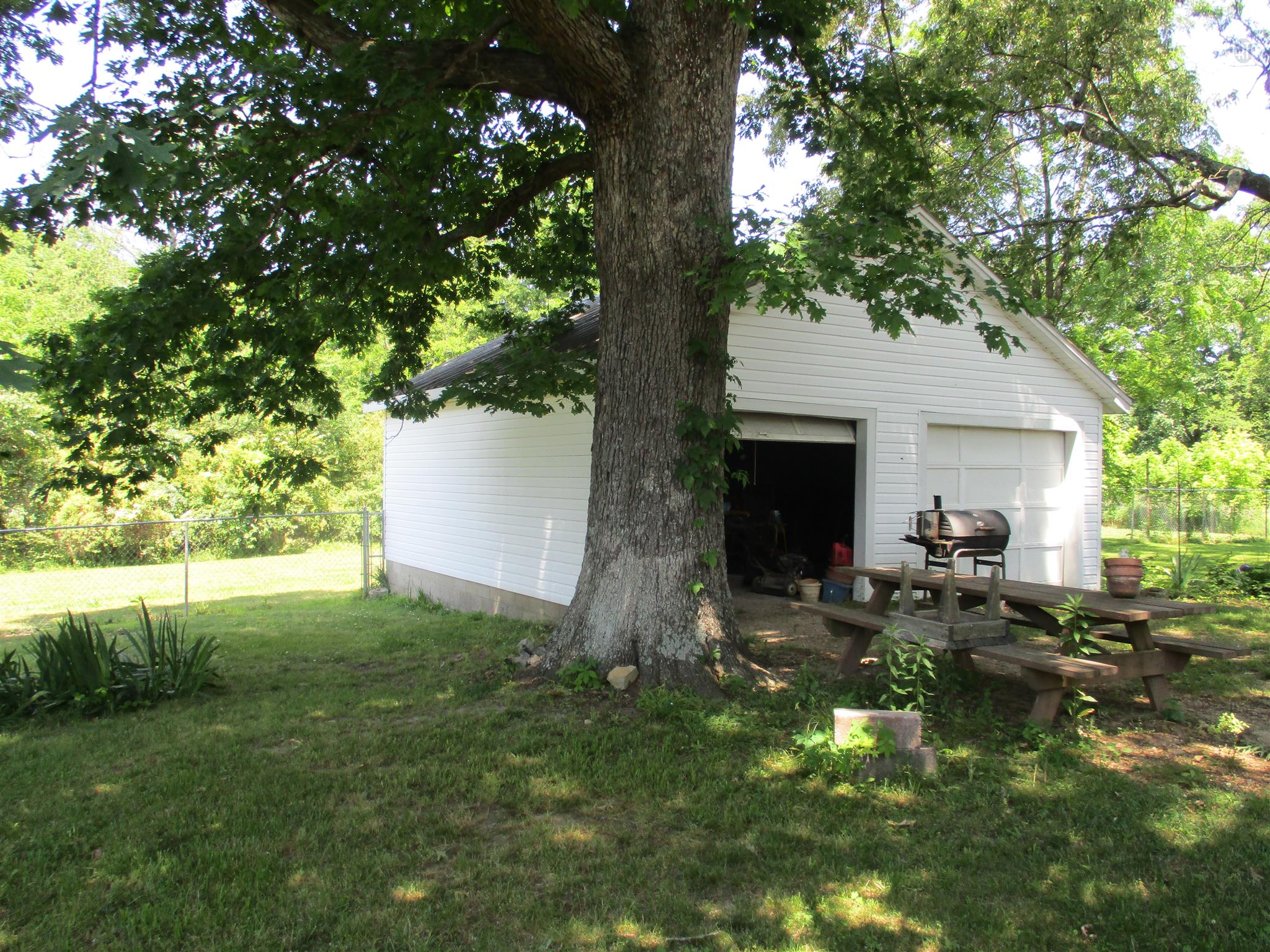 23 Ingram Road Leoma, TN 38468 - Photo 18 of 22 a backyard of a house with table and chairs