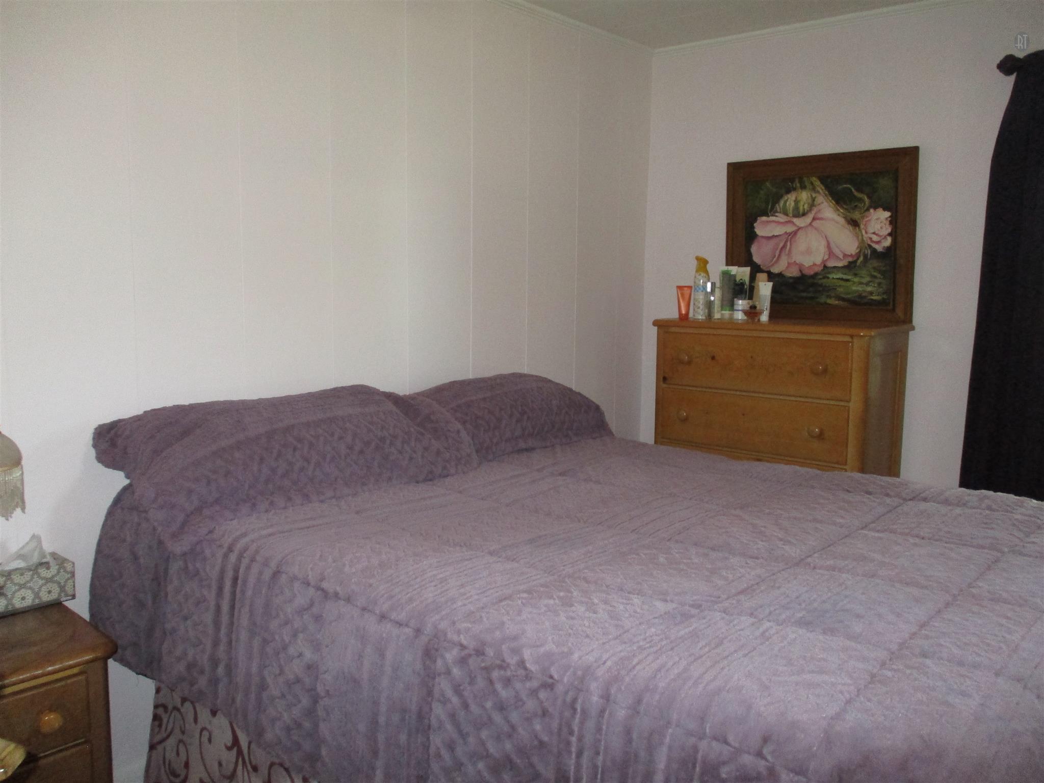 23 Ingram Road Leoma, TN 38468 - Photo 10 of 22 a bedroom with a bed and painting on the wall