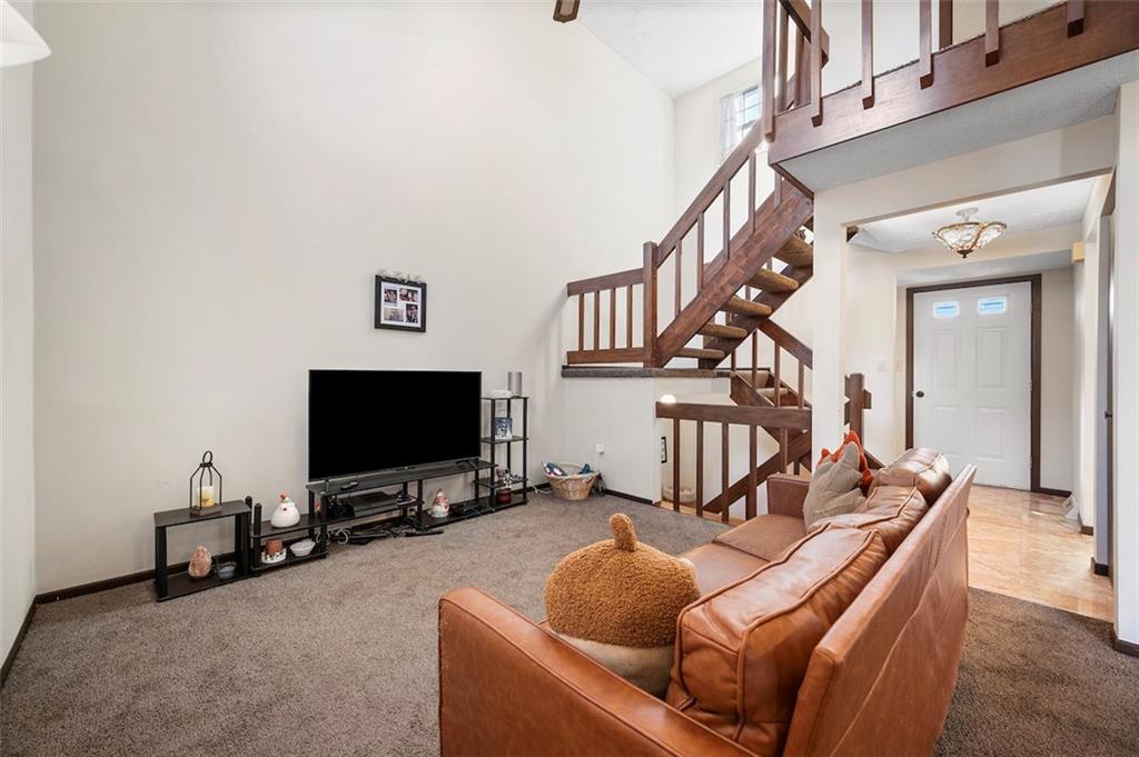 1109 Old Farm Road Lawrence, PA 15055 - Photo 14 of 28 Living Room area and staircase to upstairs from Dining area