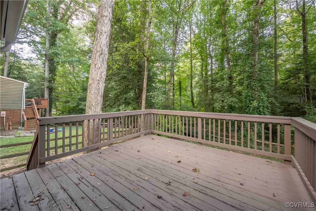 10313 Natural Bridge Road North Chesterfield, VA 23236 - Photo 15 of 31 a view of balcony with wooden floor and fence