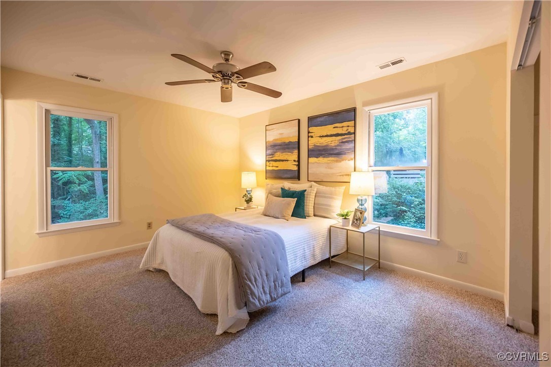 10313 Natural Bridge Road North Chesterfield, VA 23236 - Photo 16 of 31 a spacious bedroom with a bed and a window