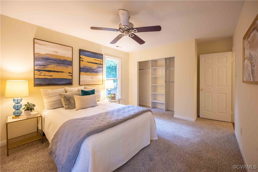 10313 Natural Bridge Road North Chesterfield, VA 23236 - Photo 17 of 31 a spacious bedroom with a bed a dresser and a window