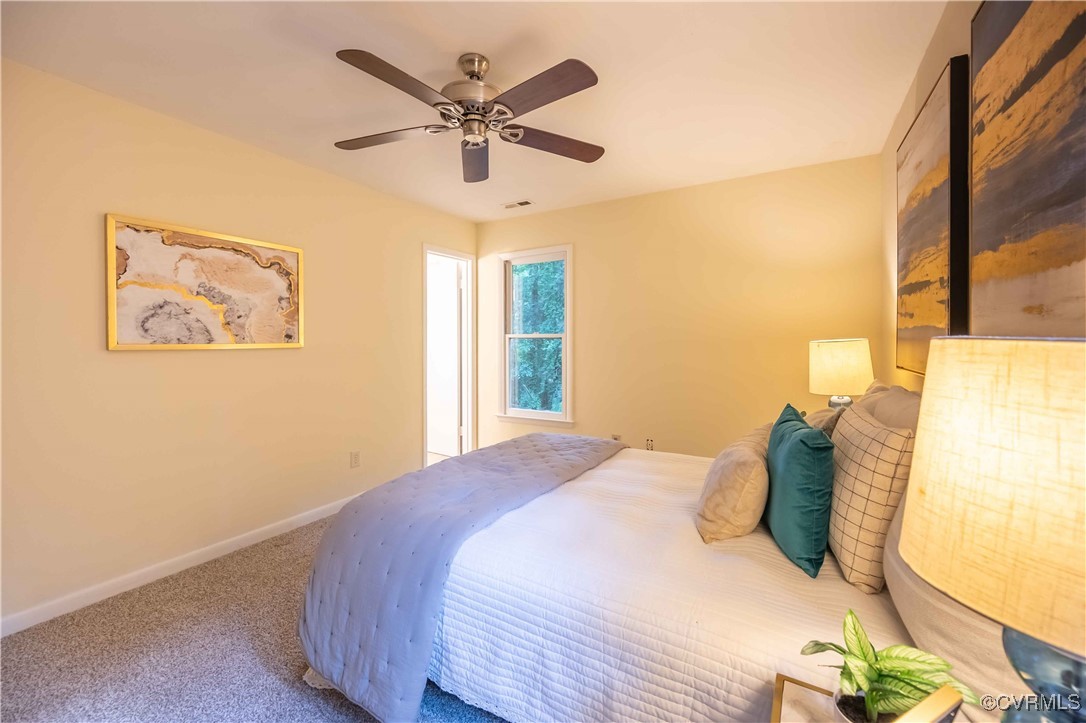 10313 Natural Bridge Road North Chesterfield, VA 23236 - Photo 18 of 31 a bedroom with a large bed and a window